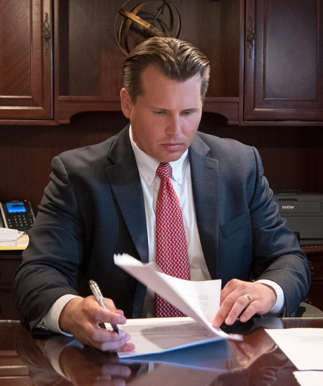 Attorney Jed Main reviewing legal documents for an eVTOL or air taxi accident case in Orlando, Florida at Main Law Firm