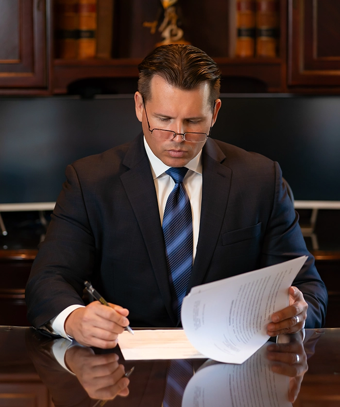Jed Main, an UPS delivery truck accident lawyer in Central Florida, reviewing case documents