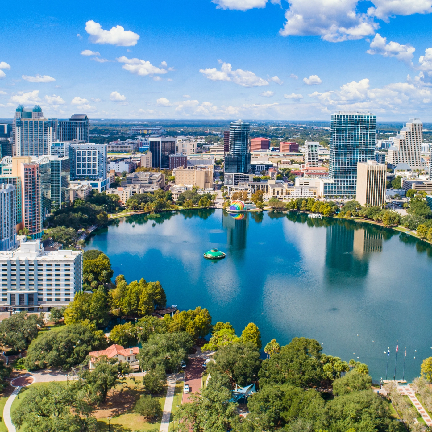 Aerial view of downtown Orlando and Lake Eola, representing the Orlando and Orange County communities served by The Main Law Firm.