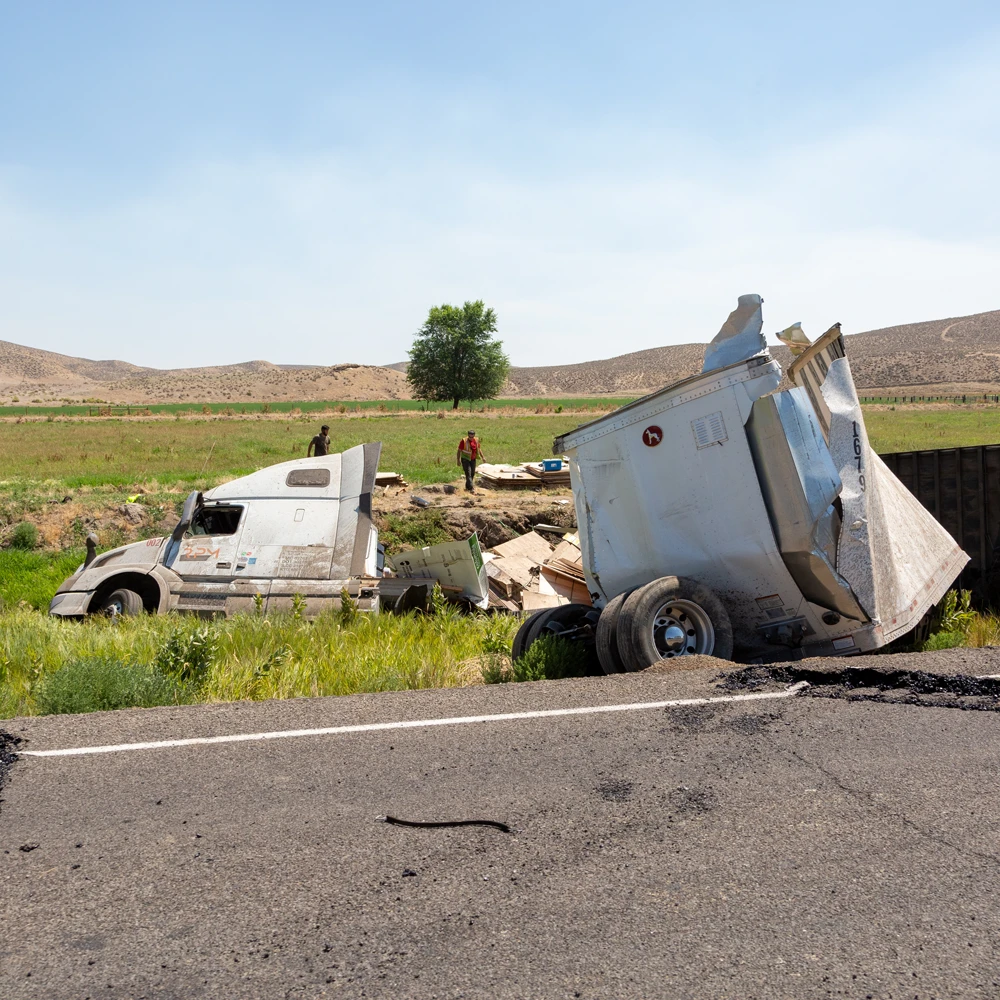 Wrecked semi-truck and damaged trailer illustrating serious truck accident cases in Orlando and Central Florida.