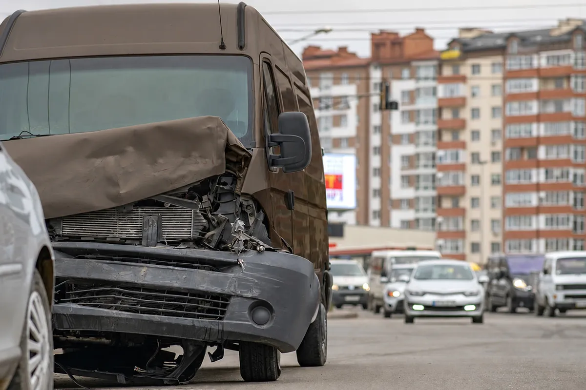 Damaged brown delivery van after a collision, representing UPS delivery van accident claims in Orlando, Florida.