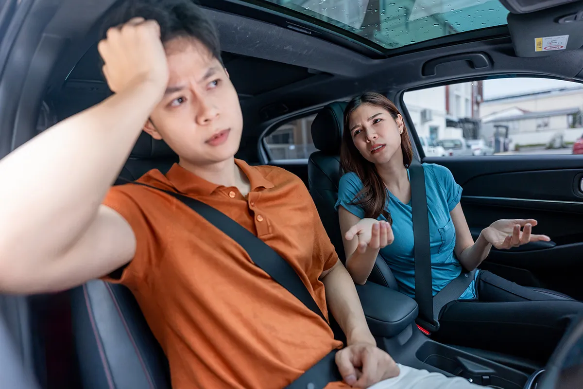 Driver and passenger inside a vehicle, representing Uber and Lyft rideshare accident claims in Central Florida.